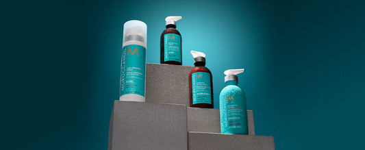four moroccanoil styling products on a pedestal 