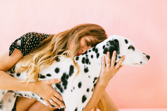 Woman hugs dog